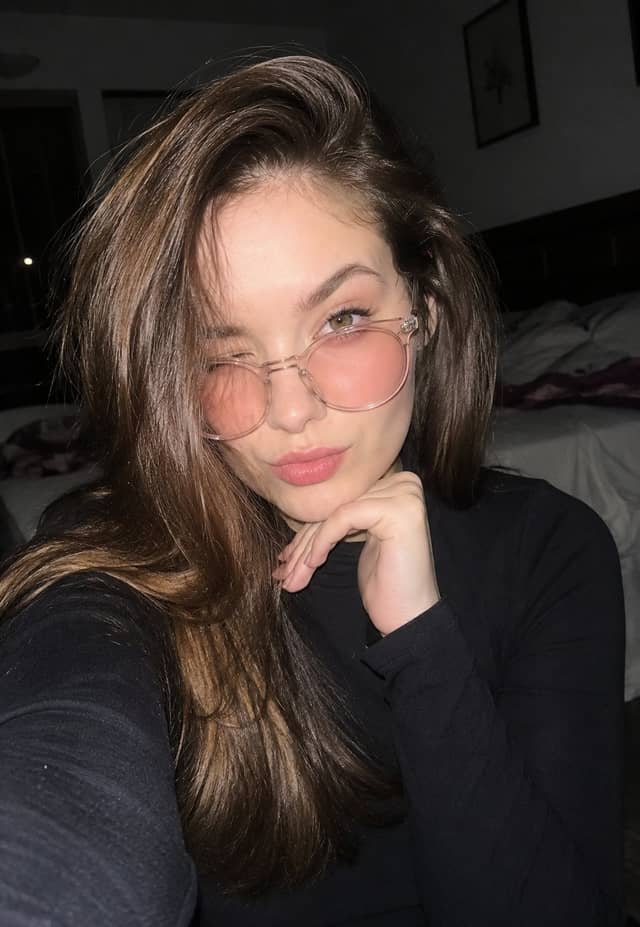 Nighttime Bedroom Selfie with Flash and Glasses